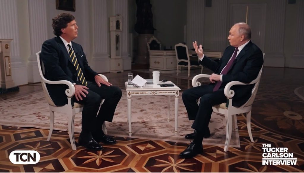 Путин на встречу с Карлсоном завязал фиолетовый галстук
